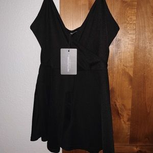Super cute and flattering PLT black romper.